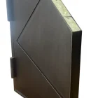 Dark galvanised steel pivot entry door with a geometric design, featuring a diamond-shaped cutout and textured surface detail.